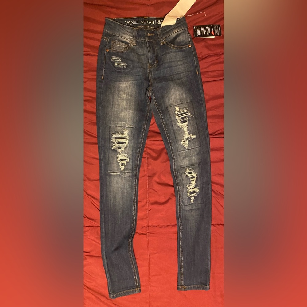 Brand new dark denim ripped blue jeans